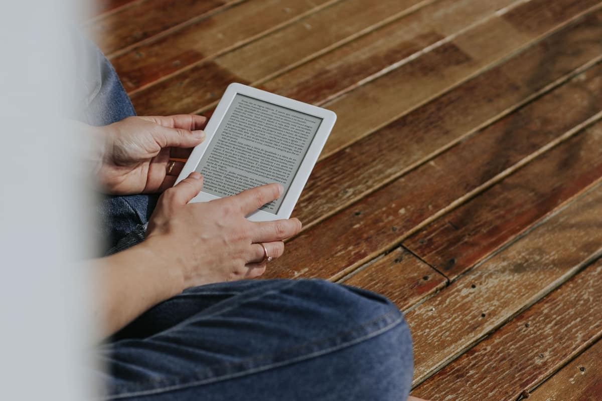 Hands holding an e-reader