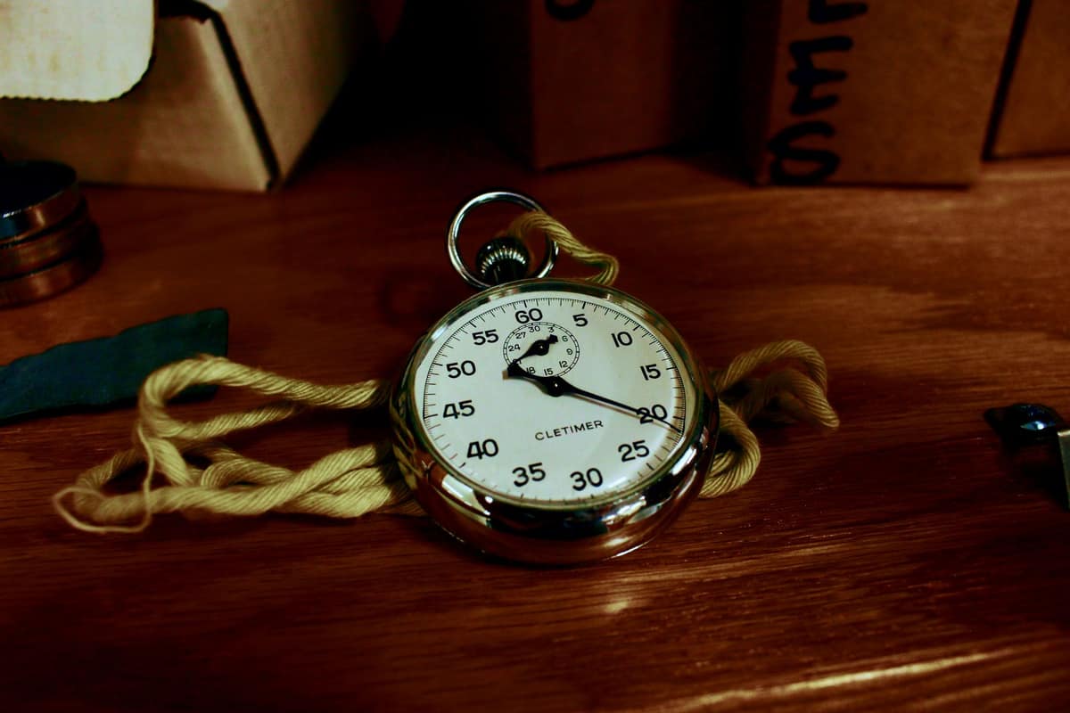 A stopwatch resting on a wooden table
