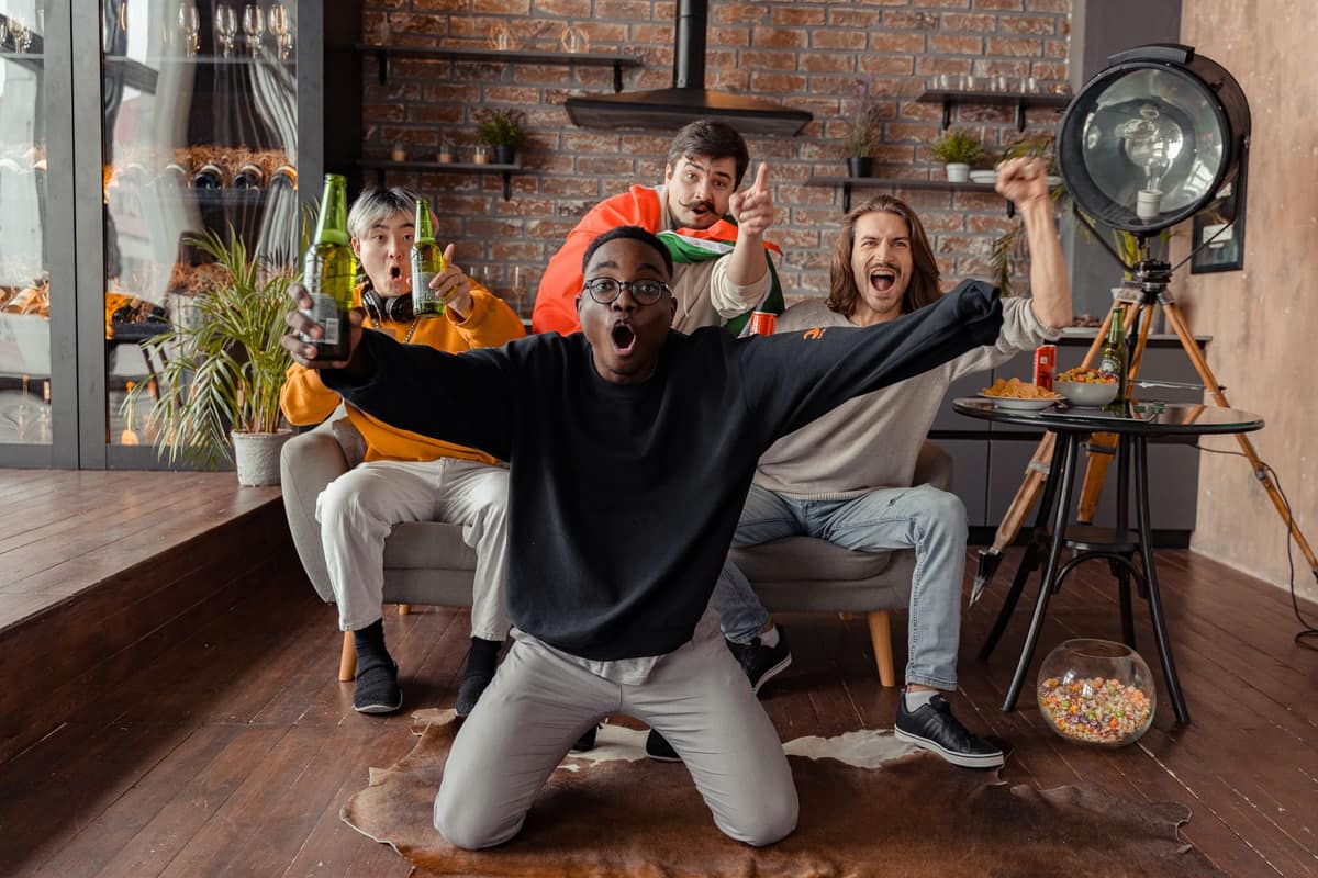 Friends watching a sports event together indoors