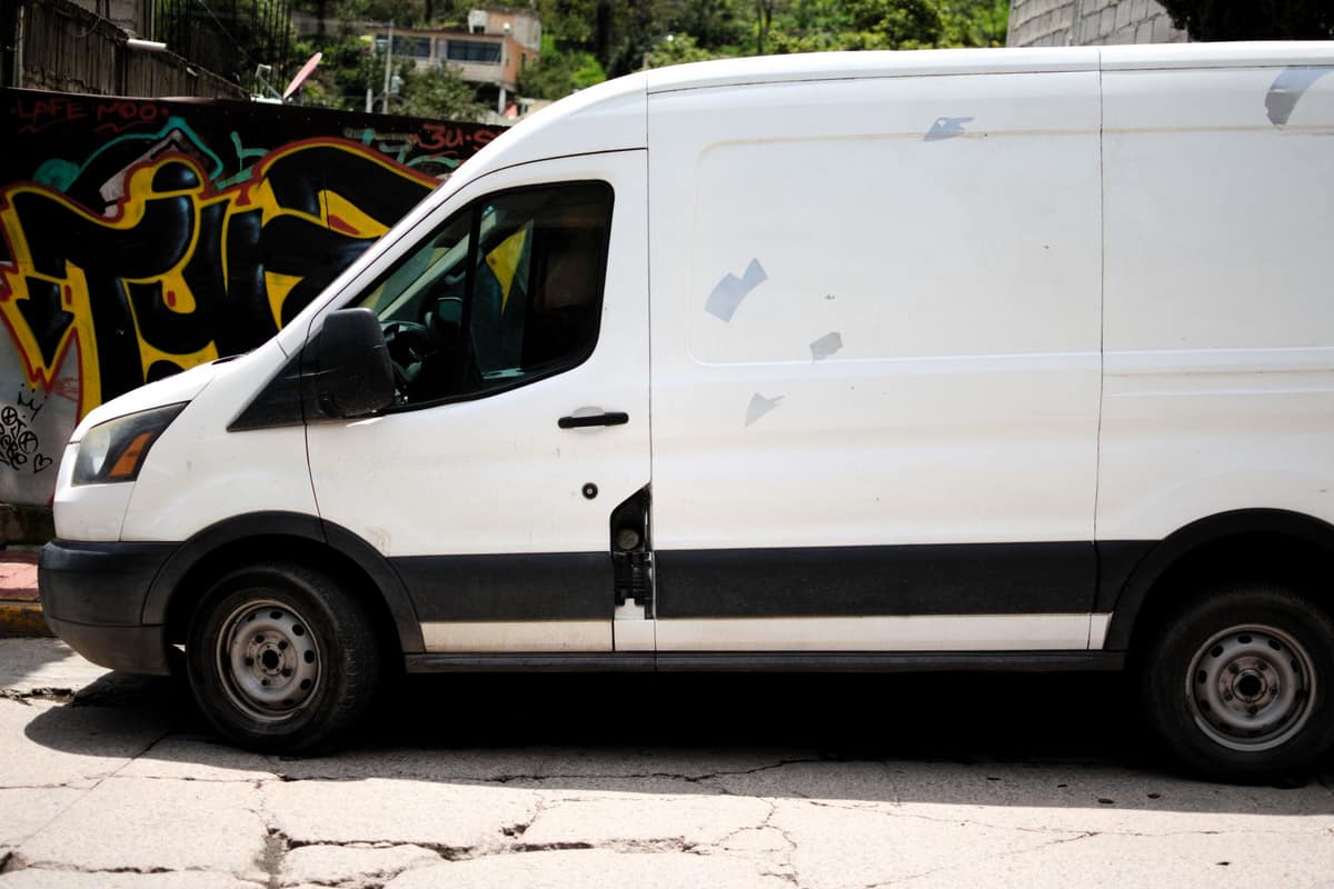 A delivery van on a sunny street