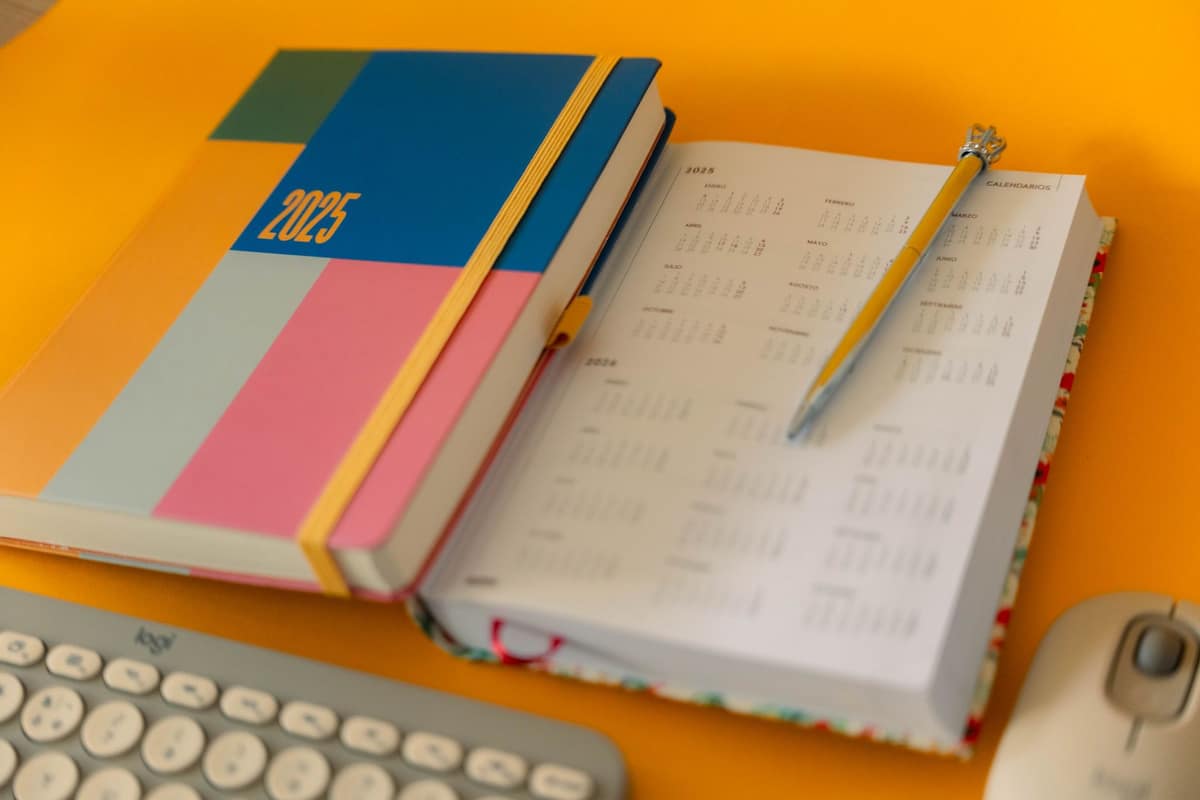 A weekly planner open on a bright desk