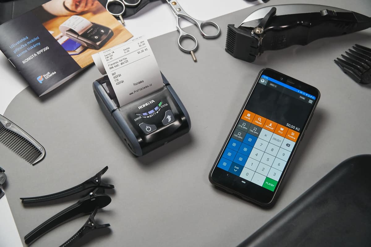 A receipt and a smartphone on a bright table